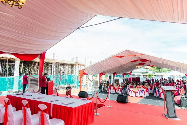 Marquee tent with stage, tables and chairs